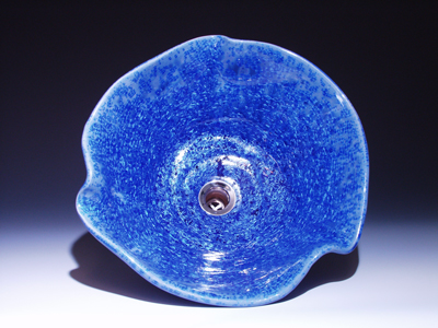 Cobalt blue vessel sink with symetrical bends, top view