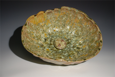 This glaze is a mixture of new green and iron we call newgreen iron mix it has a dimpled shaped