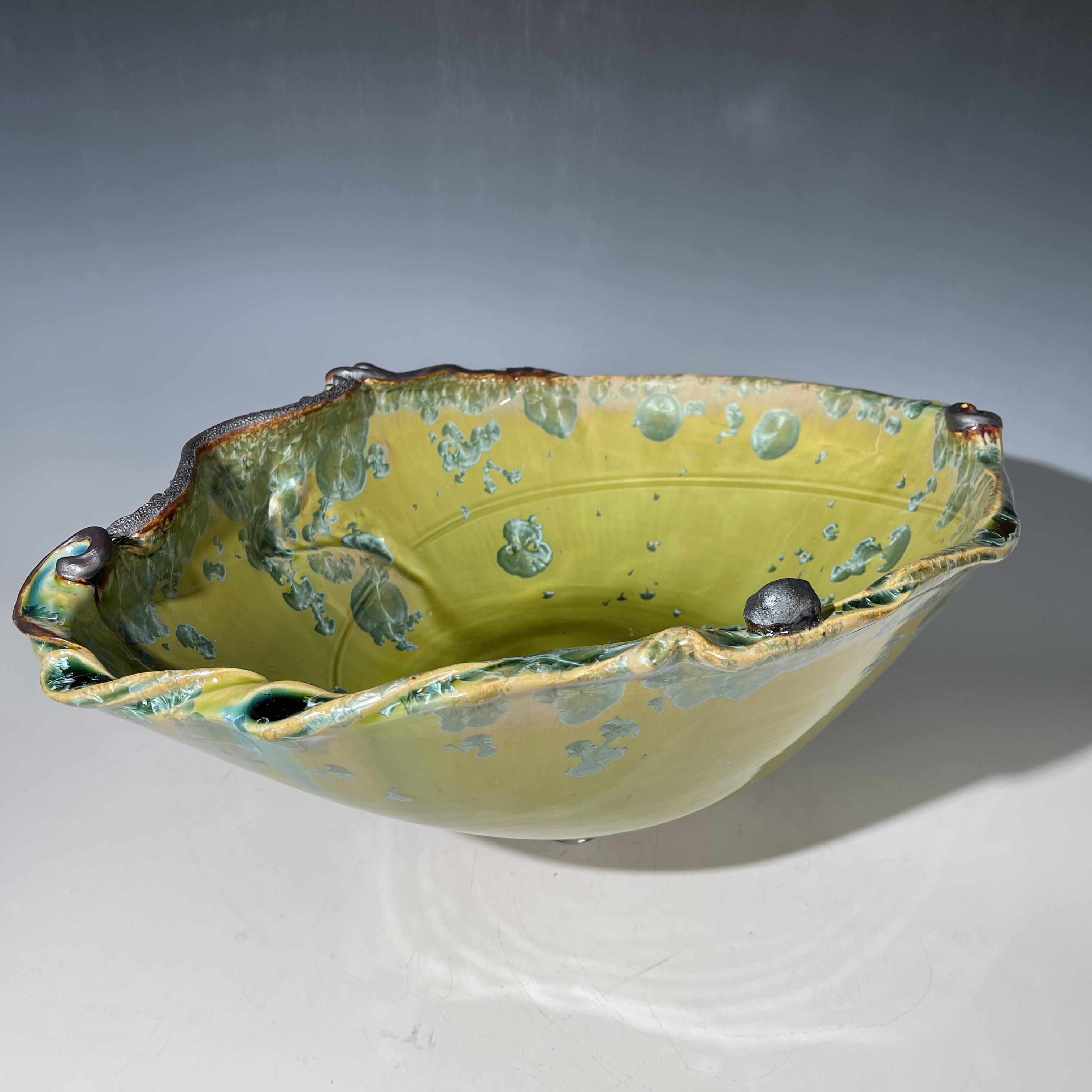 Ovoid Shaped Basin Sink in green crystal with swirling sculptural details