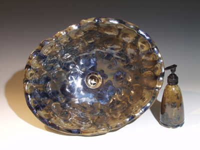 Dimple vessel sink with unusual brown background and dark blue crystals