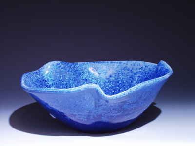 cobalt blue vessel sink with symetrical bends, side
view
