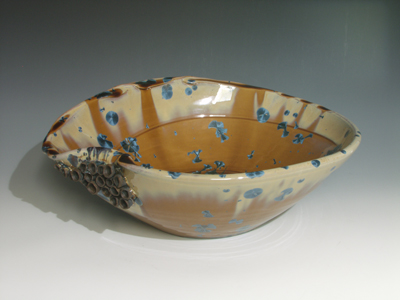 nickle crystal, orange gold with blue crystals sink with sculptural cups flowing really cool vessel sink.