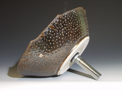 Hand made sink with spiny exterior in oilspot glaze